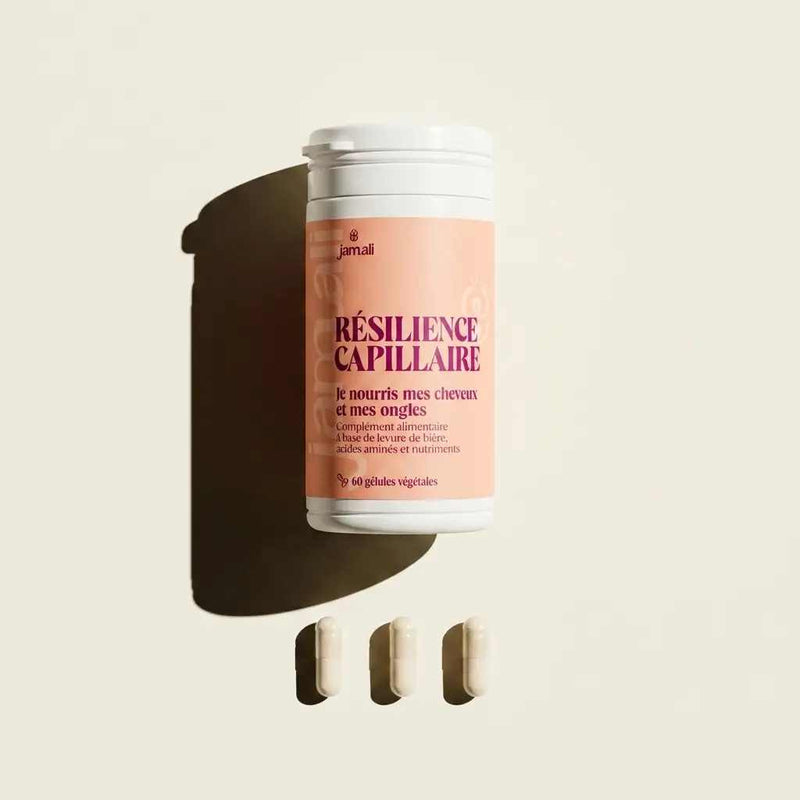 Pot de Résilience Capillaire Jamali sur fond crème avec trois gélules végétales